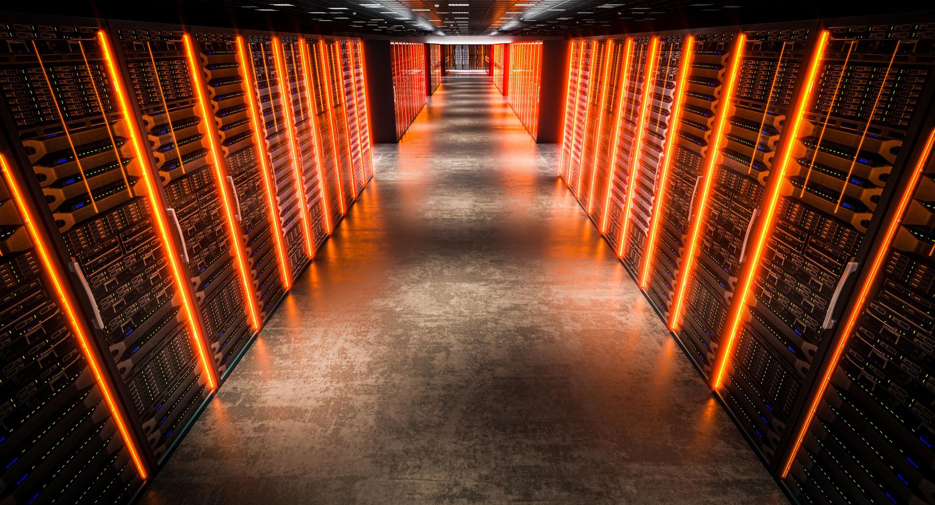 Server room with orange lights illuminating the corridor