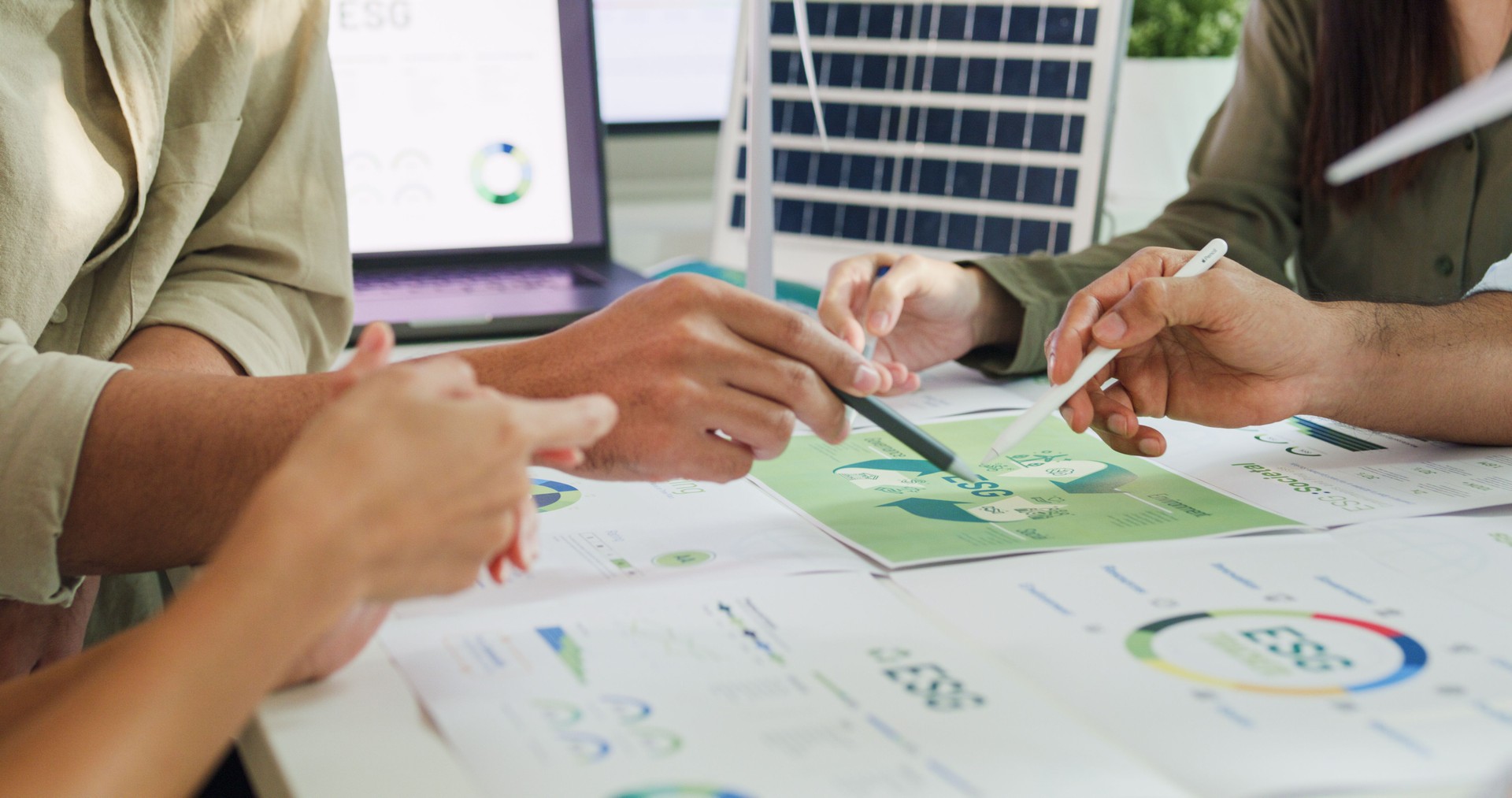 Closeup group businesspeople talk ESG strategies risk management workshop, SDGs report, global warming, green finance investment eco friendly and net zero waste in boardroom training building.